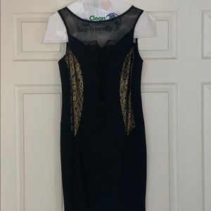 Never worn little black dress with gold accents